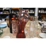 A selection of coloured glass vases and similar