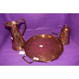 An arts and crafts copper tray with brass feet and handles to either side,jug(J.S&S.B to