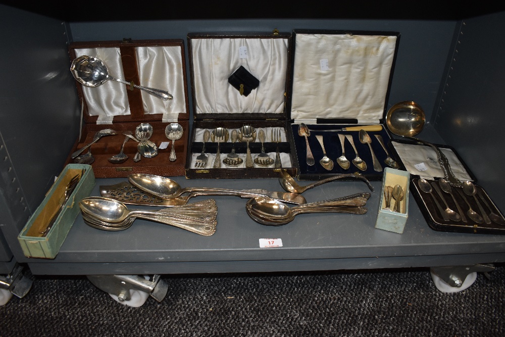 A selection of fine boxed cutlery and flatware including desert spoons and ladel