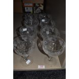 Eight large sundae glasses or dishes having etched grape vine and leaf pattern.