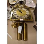 A brass faced long case clock mechanism stamped Tempus Fugit