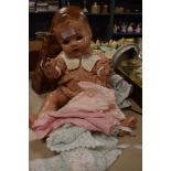 A mid century Pedigree doll having poseable limbs and sleep eyes, she even comes with a change of