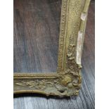 A gilt plaster picture frame