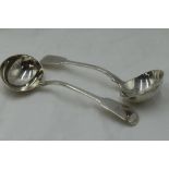 A pair of Georgian silver sauce ladles of fiddle back form bearing griffin crest to terminals,