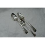 Two Georgian table spoons of Old English form bearing monogram to terminals, London 1803/17,