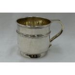 A silver christening mug having reeded decoration and inscribed Eric 1919, Birmingham 1920, Deakin &