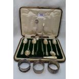 A small selection of HM silver including six teaspoons, sugar nips, napkin rings, souvenir spoon and