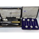 A cased set of six silver coffee spoons having coffee bean knops, Sheffield 1932, Walker & Hall, and