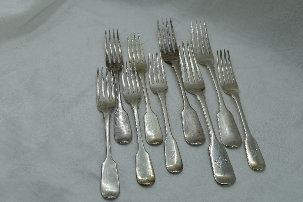 A selection of Victorian and Georgian silver table and dessert forks of fiddle back form, London