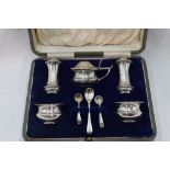 A cased five piece silver condiment set of plain form, Birmingham 1920/22, Levi & Salaman