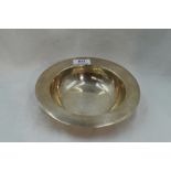 A silver lipped bowl of plain form having a rub over rim, London 1915, Edward Barnard & Sons Ltd,