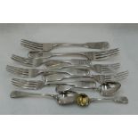 Seven Georgian and Victorian silver table and dessert forks all of fiddle back form, all Exeter