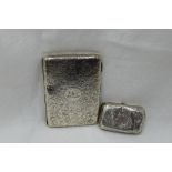 A Victorian silver aide memoire purse having engraved scroll decoration and monogrammed cartouche