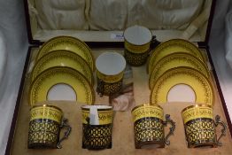 A cased set of six silver mounted Copeland Spode coffee cans and saucers having gilt decoration to