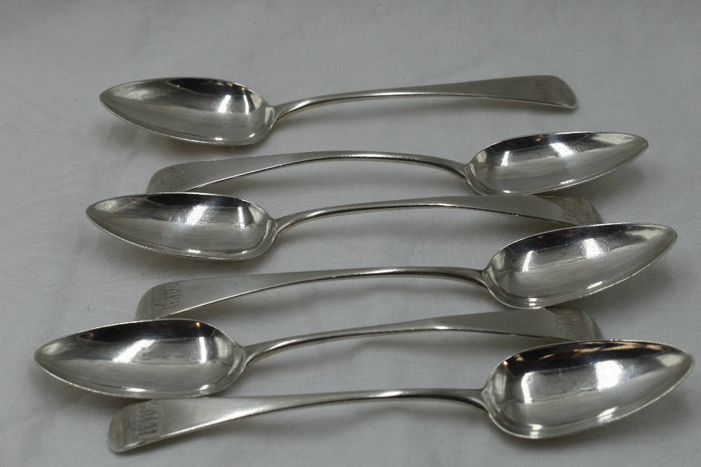 Six Georgian silver dessert spoons of Old English form bearing monogram to terminals, London 1803,