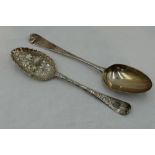 A Georgian silver berry spoon having frilled rim to bowl and later chased stem, London 1749,