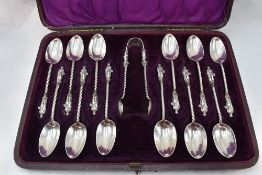 A cased set of twelve Victorian Apostle teaspoons with matching sugar nips, all having twist stems