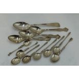 A selection of white metal and HM silver spoons of assorted forms including Dutch Apostle spoons,