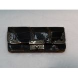 A small Edwardian brown leather coin purse having silver fitments, London 1902 & Birmingham 1902