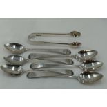 A set of six Georgian silver teaspoons of old English form bearing monogram to terminals, London
