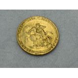 A Gold George III 1820 Laurel Head Sovereign with George and Dragon on reverse, in plastic case