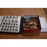 An album and tin of GB and World Coins and Banknotes