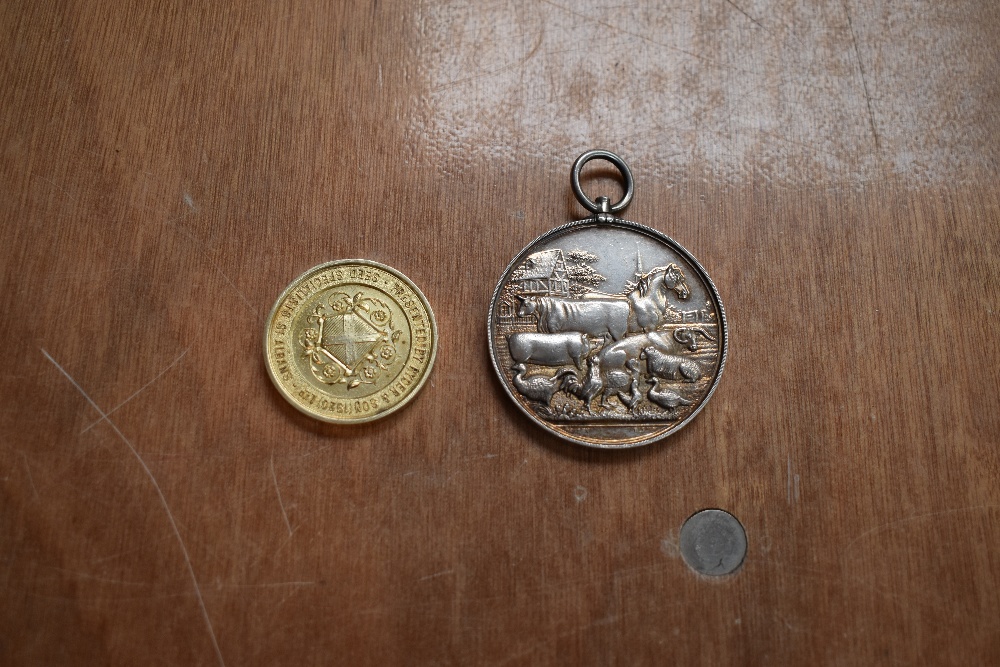 Two Agricultural Medallions, one white metal inscribed Westmoreland and Kendal District Agricultural