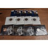 A collection of 12 UK Brilliant Uncirculated 5 Pound Coins in folders, Prince George 2013 x4,