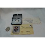 A 1982 Silver 250th Anniversary of Washington Half Dollar, a Morgan 1880 Silver Dollar and a