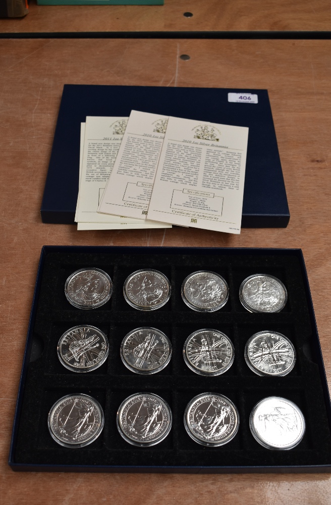 A collection of 12 GB 1oz Fine Silver Britannia 2 Pound Coins in tray, 2010 x4, 2011 x4 and 2012 x4