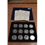 A collection of 12 GB 1oz Fine Silver Britannia 2 Pound Coins in tray, 2010 x4, 2011 x4 and 2012 x4