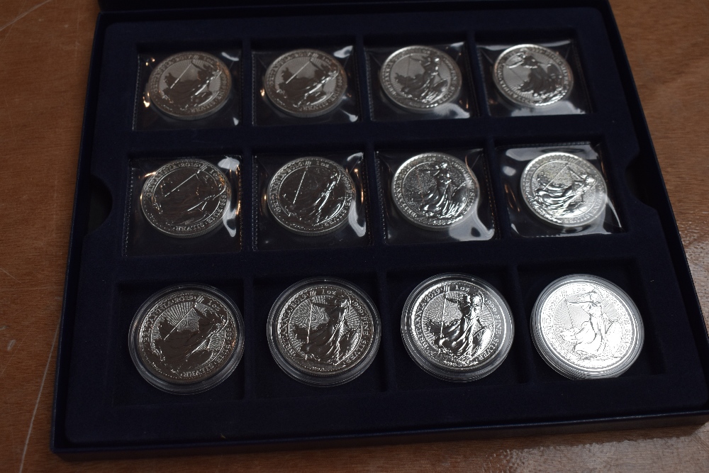 A collection of 12 GB 1oz Fine Silver Britannia 2 Pound Coins in tray, 2017 x4, 2016 x4 and 2019 x4