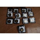 A collection of 13 Tristan Da Cunha 1 Gram Proof 9 Carat Gold Coins in plastic cases