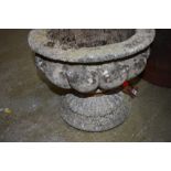 A cast concrete planter