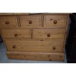 A vintage pine shallow chest of 'Ted Rogers' drawers, dimensions approx. W88 D29 H83cm (including