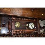 An early to mid 20th Century mahogany cased Vienna wall clock