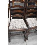 A set of four traditional ladderback dining chairs