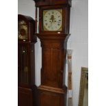 An oak cased long case clock, having 8 day movement and painted dial