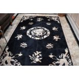 Two modern chinese rugs, in black and cream, approx. 300 x 196cm and 196 x 90cm