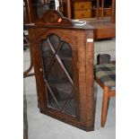 A 19th Century oak corner wall display cabinet