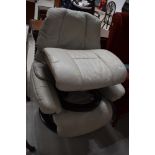 A vintage grey leather Stressless chair and footstool