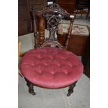 A Victorian nursing chair having pink dralon button seat