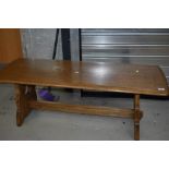 A modern oak coffee table, Ercol style, approx. 122 x 47cm