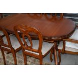 A modern extending dining table, good quality (Rossmore or similar) possibly Cherry and six (four