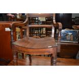 A 19th Century mahogany carver chair having shaped seat on turned frame