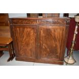 A Victorian flame mahogany bookcase base or sideboard, width approx. 120cm