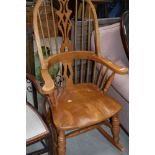 A vintage Windsor style rocking chair, beech or rubberwood