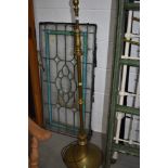 A vintage brass standard lamp