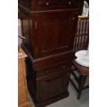 A pair of modern mahogany bedside cabinets