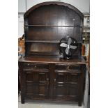 A vintage Priory style dresser having semi arch top